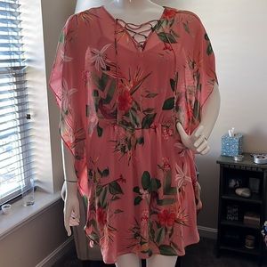Coral colored beach or poolside dress with green and orange orchids. Size M